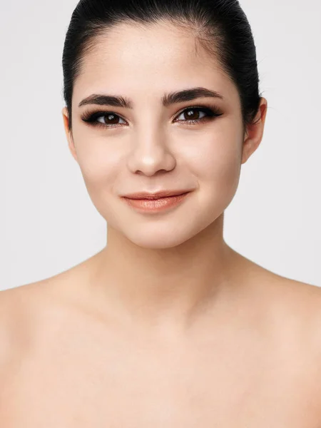 Cheerful pretty woman with bare shoulders cosmetics close-up studio — Φωτογραφία Αρχείου