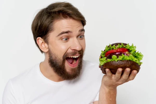 Bearded man hamburger fast food emotions close-up snack — Stock fotografie