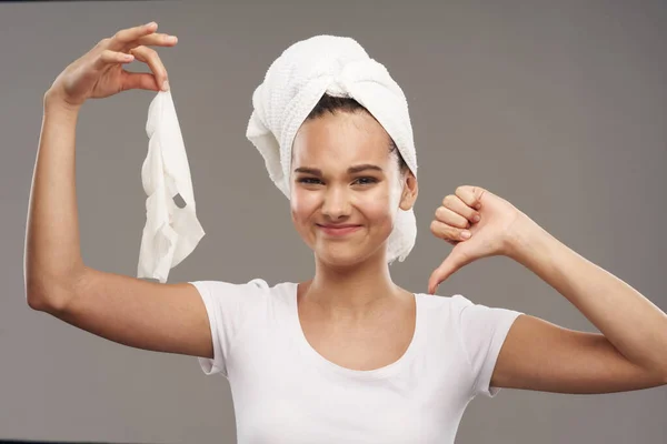 Pretty woman with towel on head clean skin face mask — ストック写真