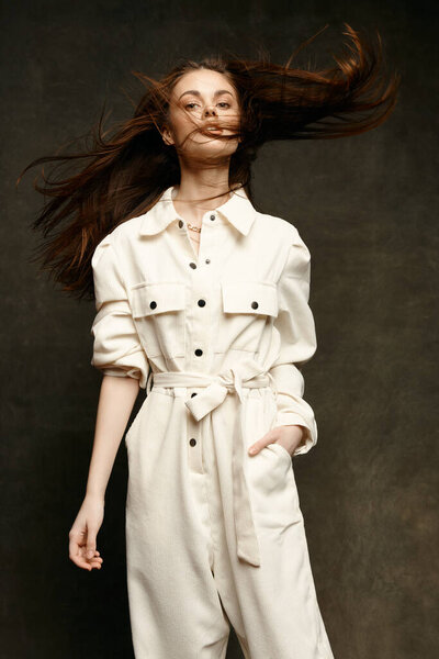 portrait of beautiful people in overalls on dark background cropped view