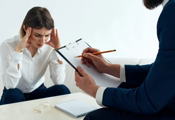 Employees men and women at the table communicating psychologist documents