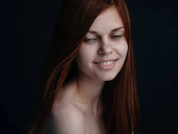 Beautiful woman red hair black background smile model close-up — Stock Photo, Image