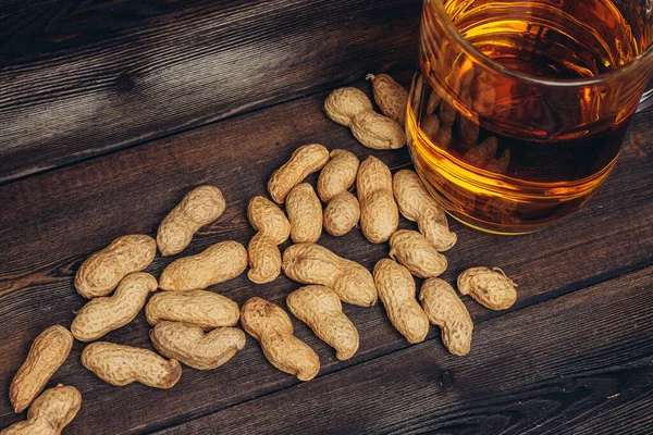 peanuts in shells beer mug bar counter alcohol pub