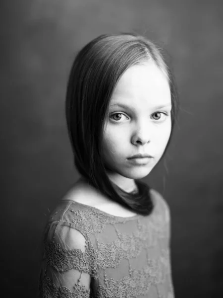 Beautiful little girl portrait close-up cropped view in dark background model — Stock Photo, Image