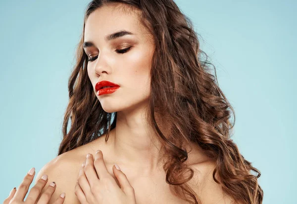 Sexy brunette red lips bared shoulders romantic look model makeup
