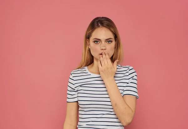 Happy blonde on pink background gesturing with hands — Φωτογραφία Αρχείου