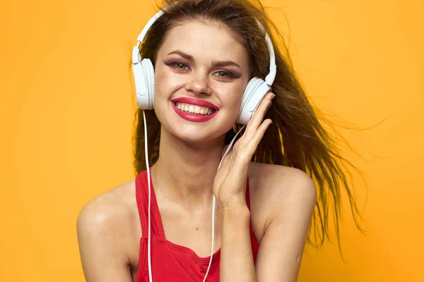 Cheerful woman in headphones music lifestyle yellow background — Stock Photo, Image