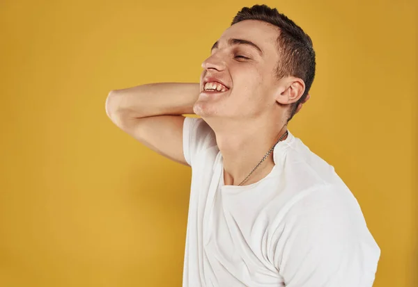 Joyful man gesturing with his hands on yellow background cropped view — Stock Photo, Image