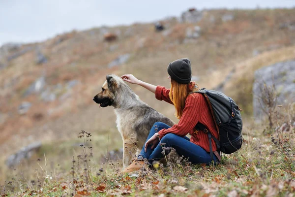 Woman hiker mountains with dog in nature friendship travel vacation — Stock Photo, Image