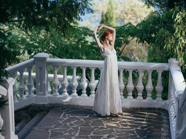 Woman in white dress nature green leaves Greece mythology decoration. High quality photo