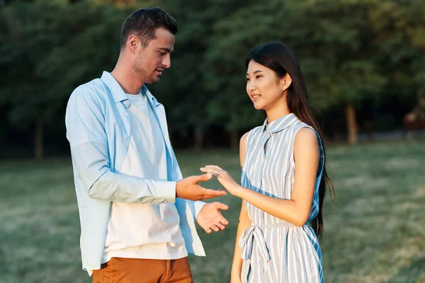 Young couple outdoors walk communication dating lifestyle — Stock Photo, Image