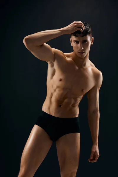 Handsome man in dark panties muscled studio model — Stock Photo, Image