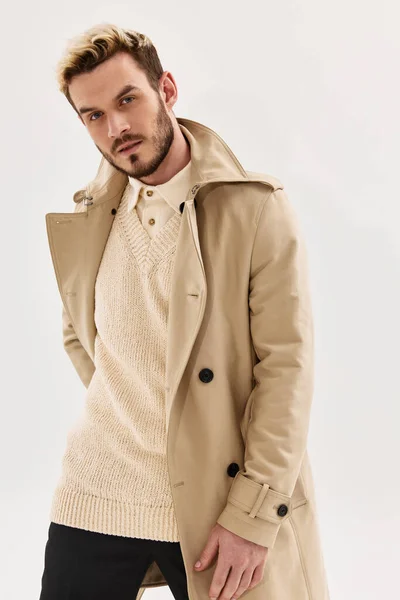 Handsome man in coat studio fashion attractive look light background — Stock Photo, Image