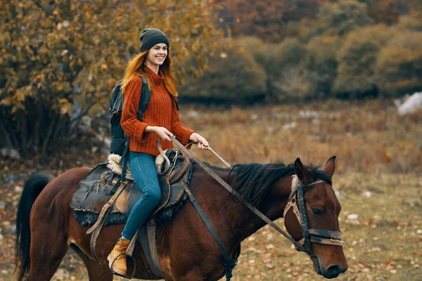 Woman hiker riding horse mountains landscape travel adventure — Stock Photo, Image