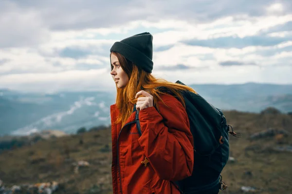 Woman mountains landscape clouds sky autumn fresh air tourism travel — Stock Photo, Image