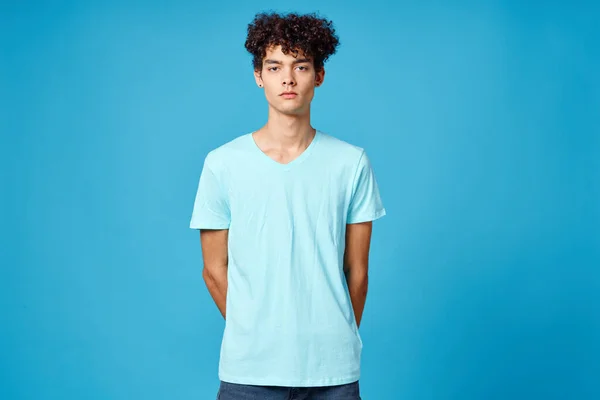 Cute guy curly hair blue t-shirt isolated background — Stock Photo, Image