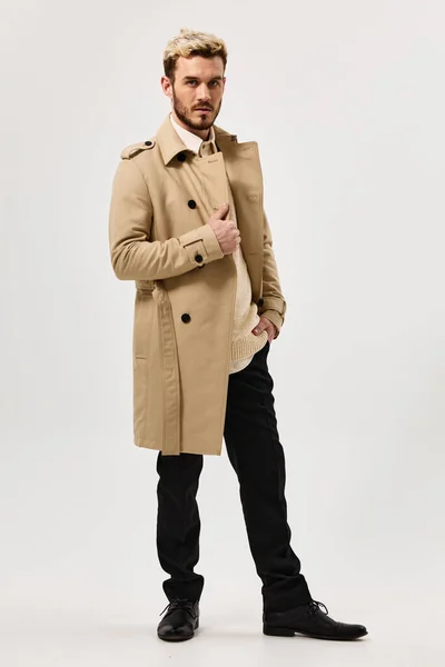 man with trendy hairstyle coat modern style fashion clothing
