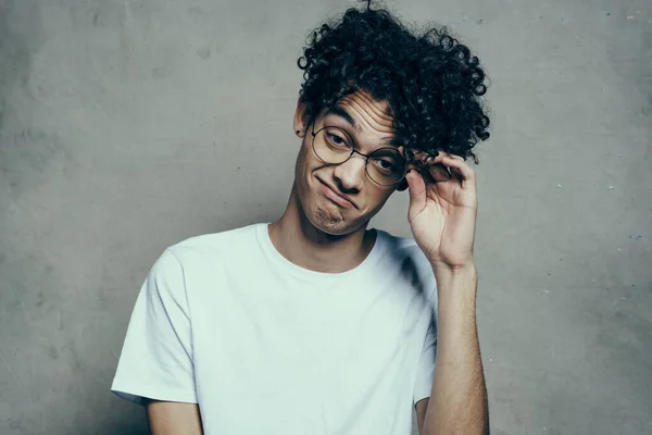 Man with curly hair wearing glasses emotions white t-shirt studio — Stock Photo, Image