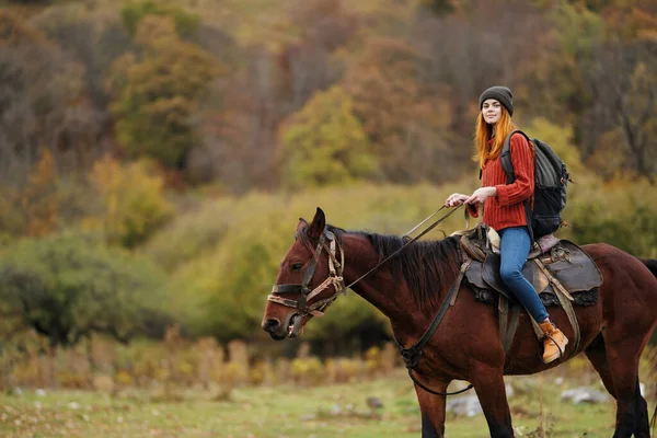 Woman hiker travel mountains nature riding horse landscape — Stock Photo, Image