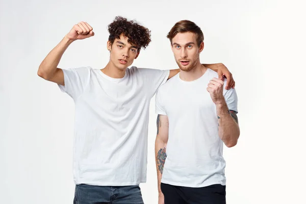Two men are standing next to clean t-shirts emotions — Stock Photo, Image