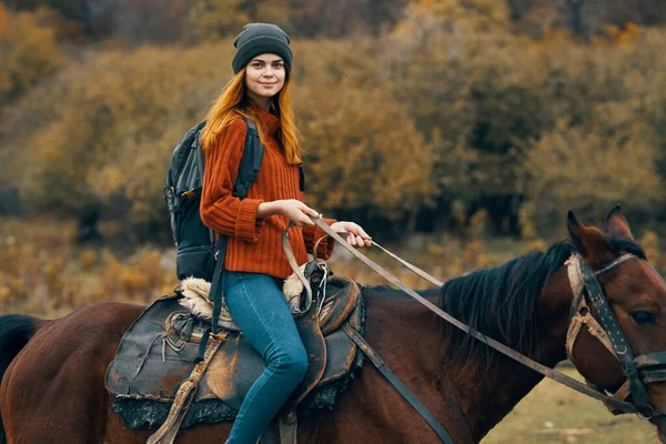 Woman tourist riding horse mountains landscape lifestyle — Stock Photo, Image