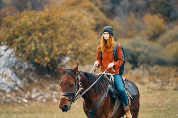 Woman hiker riding horse travel mountain walk adventure — Stock Photo, Image