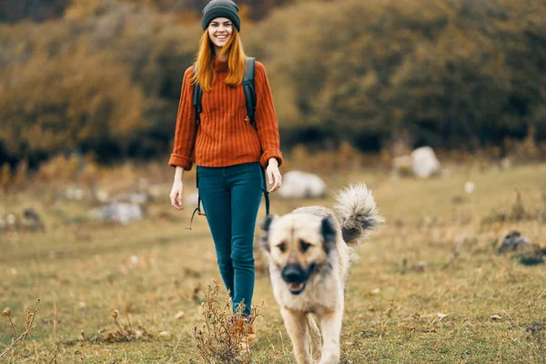 woman hiker walking the dog outdoors in the forest freedom travel