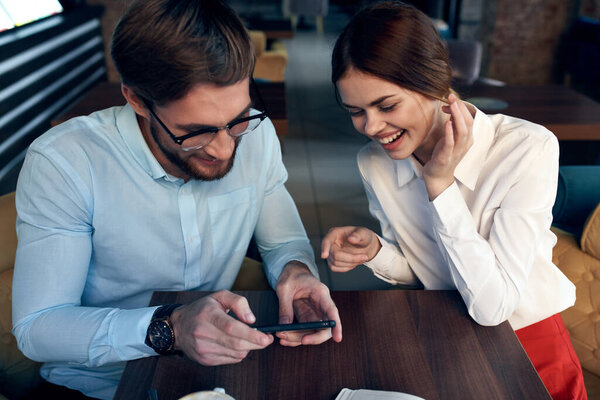 business man and woman in cafe breakfast leisure communication technology