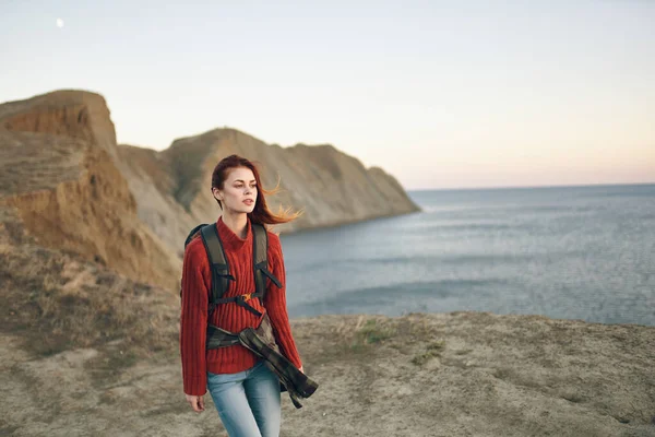 woman with backpack mountains landscape tourism travel adventure sea model