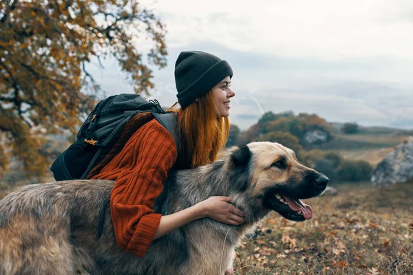 Hiker in nature with dog travel friendship landscape — Stock Photo, Image