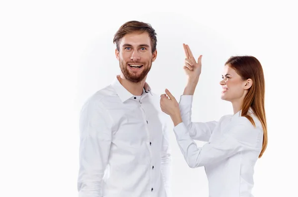 Cheerful employees gesturing with their hands to work light background shirt communication model — Stock Photo, Image