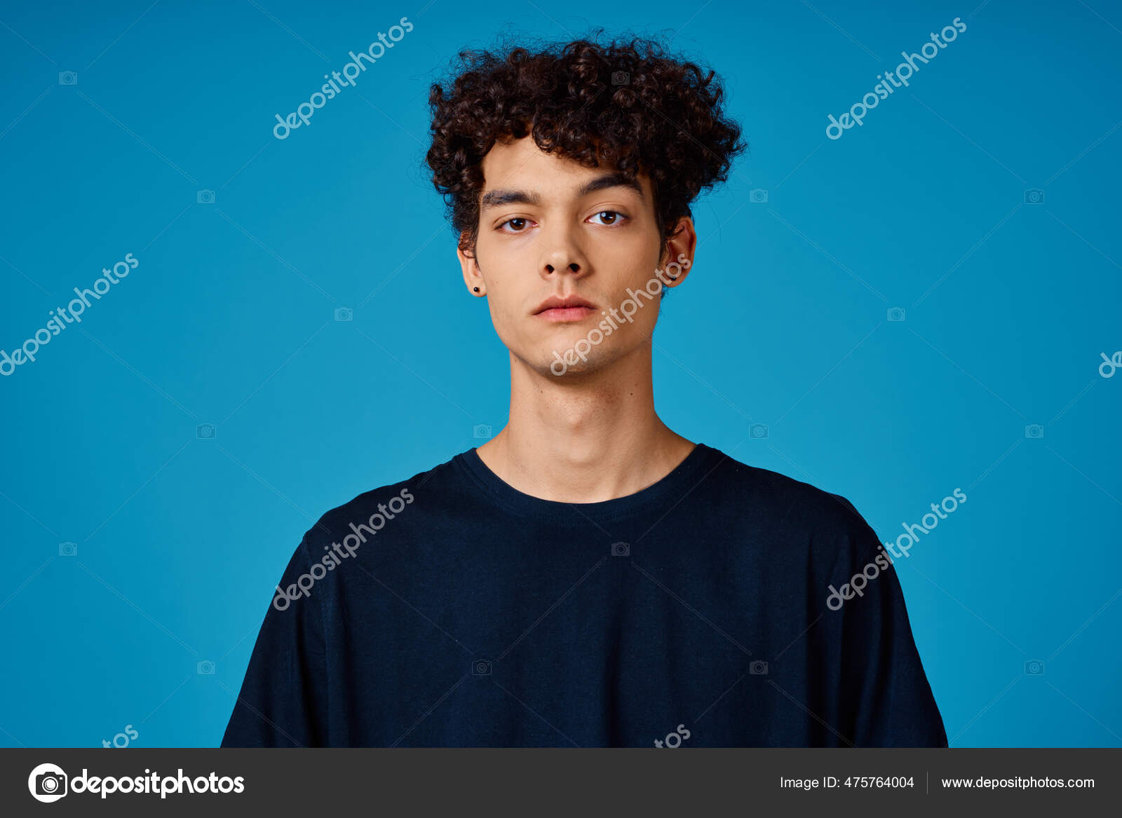 Premium Photo | A man with curly hair and a blue cross on his head