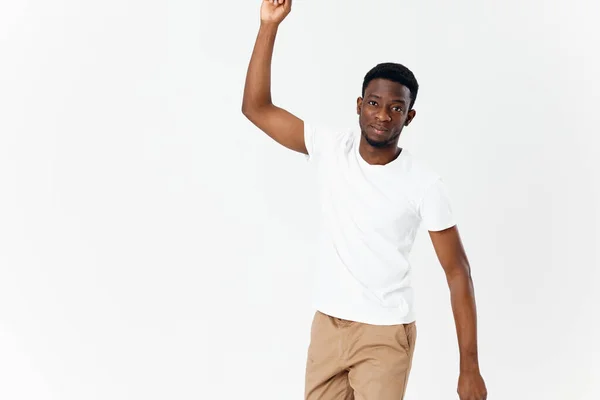 Afro-americano segurar uma mão de cima em um fundo leve — Fotografia de Stock