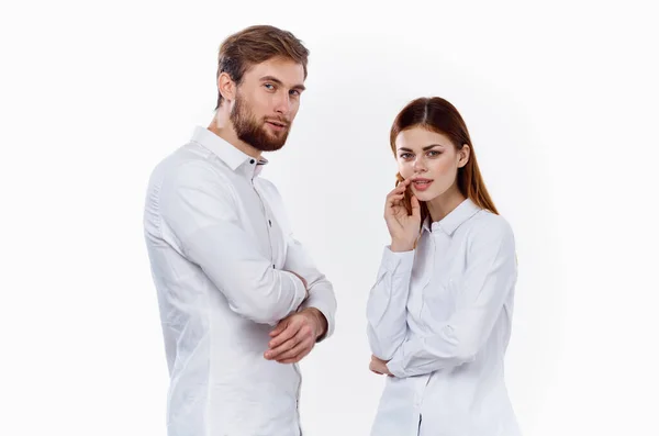 Friends family man and woman in identical shirts on a light background — Stock Photo, Image