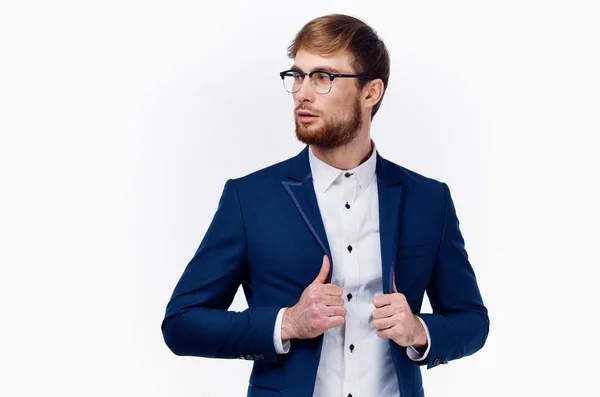 Blond man in classic suit straightens jacket sleeve cropped view — Stock Photo, Image