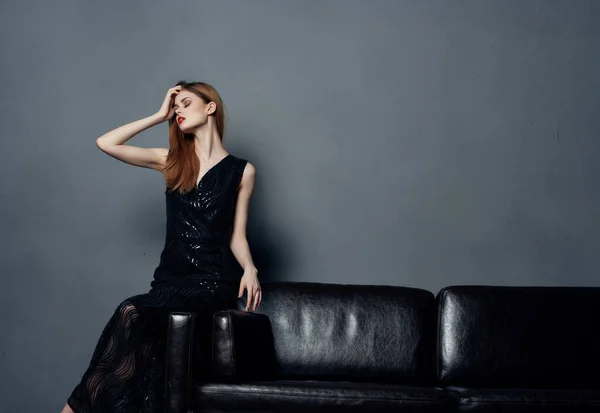 Woman Evening Black Dress Sitting Sofa Posing — Stock Photo, Image
