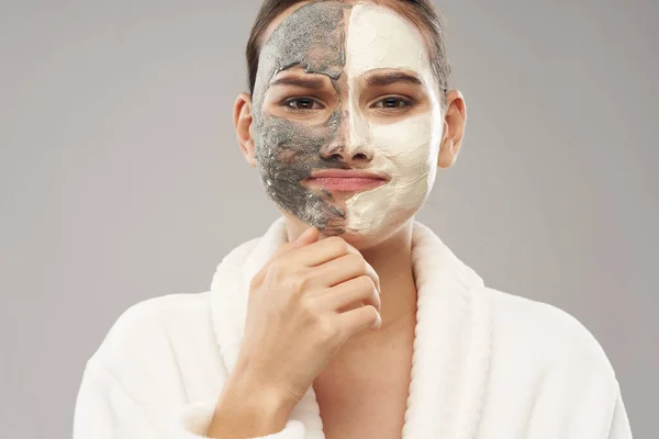 Woman face mask white robe skin care rejuvenation — Stock Photo, Image