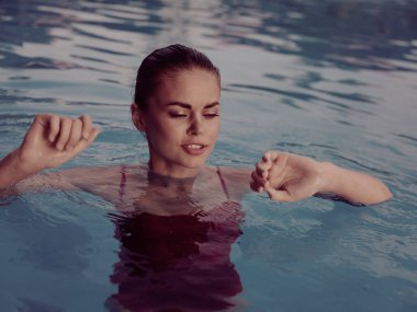 woman in red swimsuit Swimming in the pool vacation luxury travel nature