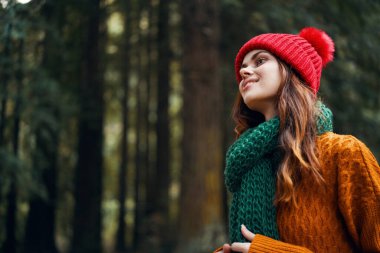 woman hikers in the woods walk travel in autumn