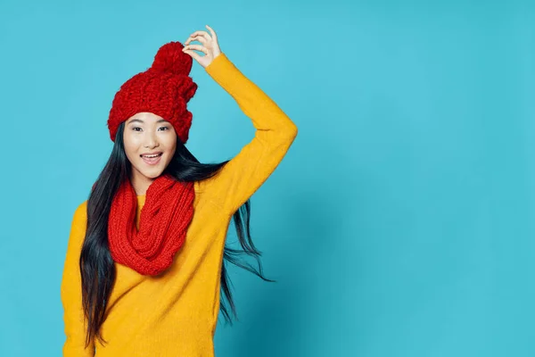 Woman of asian appearance in winter clothes red scarf and hat — Stok fotoğraf