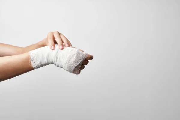 Injured arm bandaged medicine traumatology — Stock Photo, Image