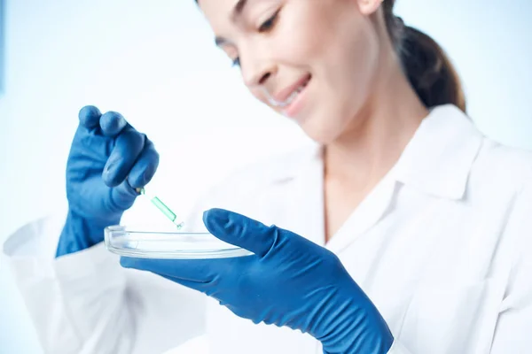 Woman in white coat laboratory research analysis science