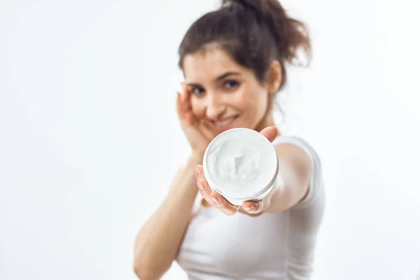 Woman in white t-shirt cream jar skin care moisturizing dermatology — Stock Photo, Image