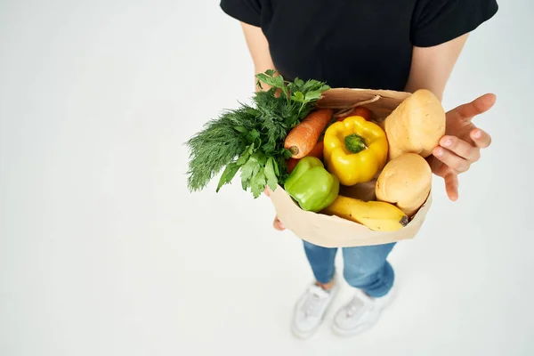 food bag in hand vegetables healthy food delivery
