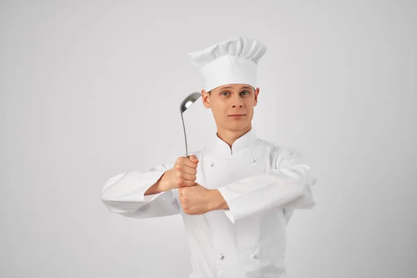 Chef with a ladle in his hands Professional cooking restaurant — Stock Photo, Image