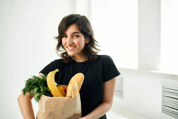 cheerful brunette food bag healthy food vegetables delivery