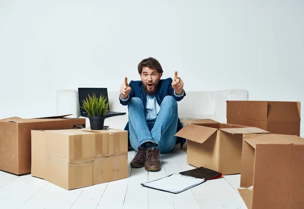 work manager office cardboard boxes with things packing moving