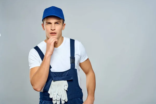 Man in work uniform courier delivery service professional — Stock Photo, Image