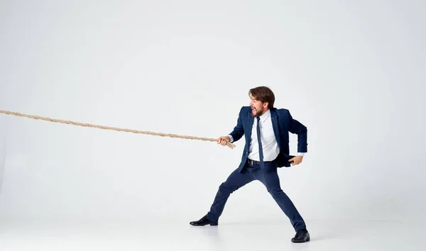 Business man in suit pulling rope Studio team work — Stock Photo, Image