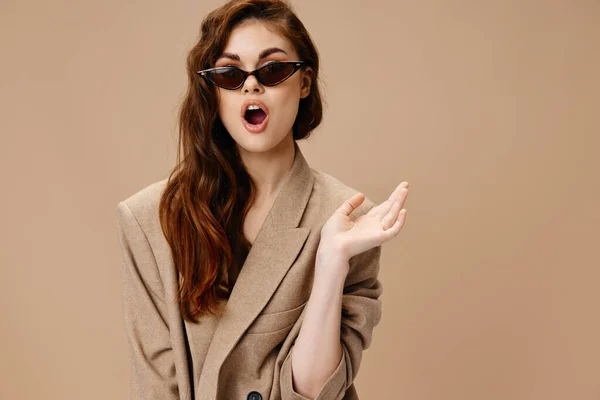 Woman in coat gesturing with hands glasses on face cropped view — Stock Photo, Image